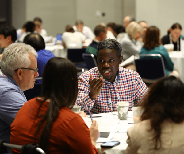 A group of people at a roundtable discussion