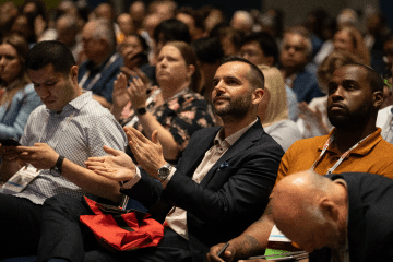 Large crowd watching conference session